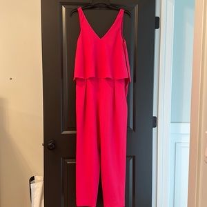 Trina Trunk jumpsuit.  Barbie pink, fun and fitting.